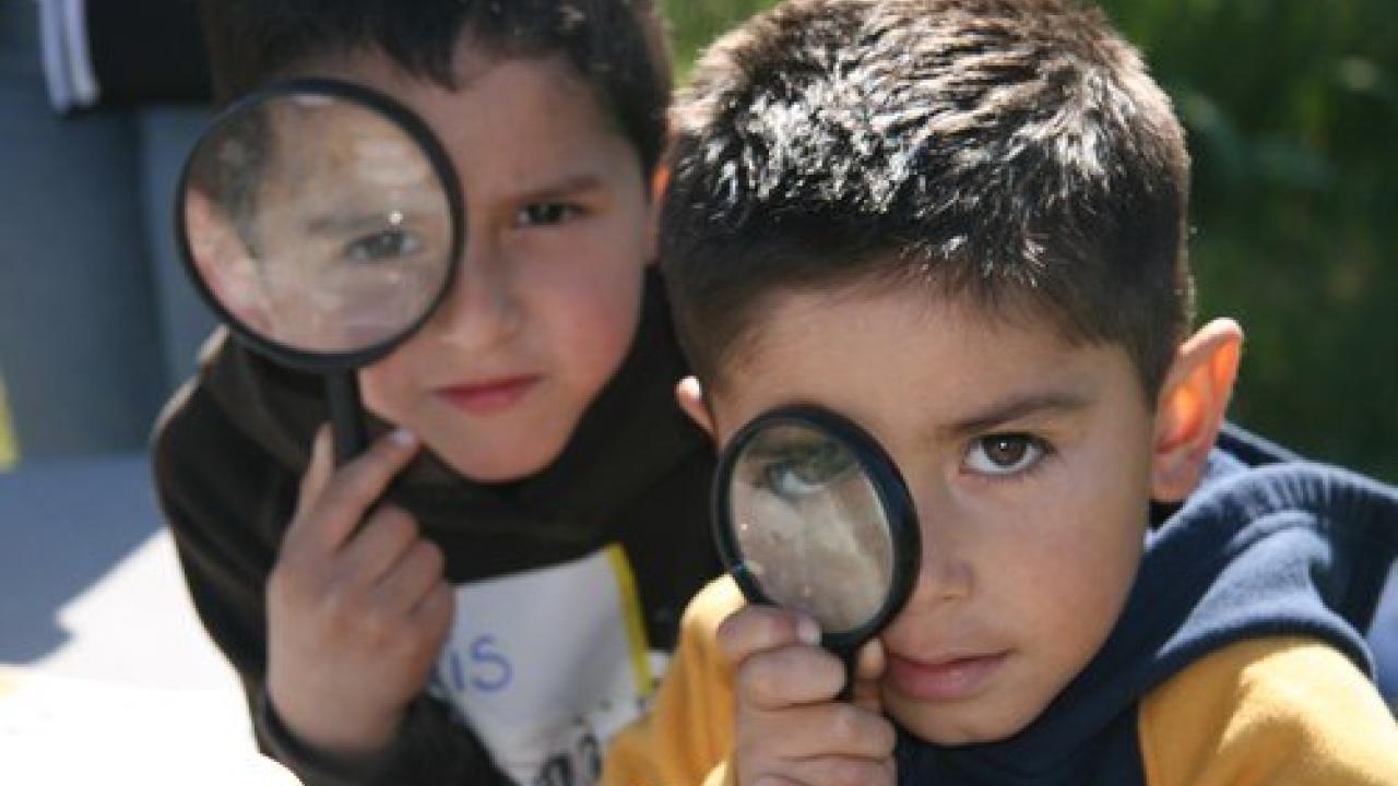 Kids with magnify glass